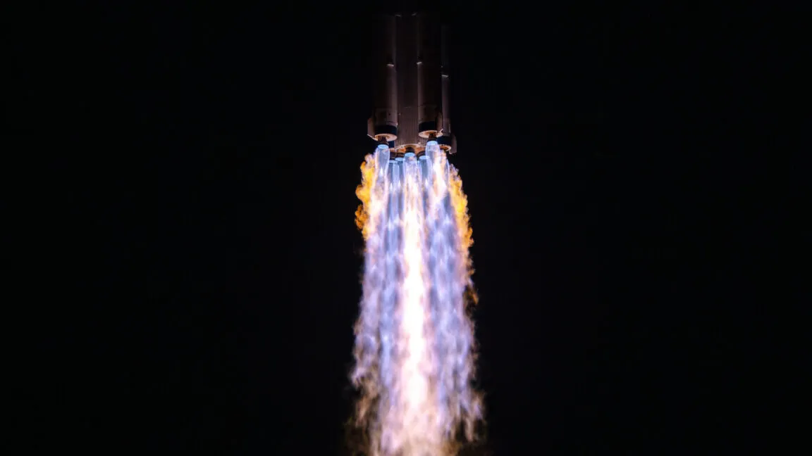 A spacecraft approaches China's Tiangong space station during a crew transfer mission.