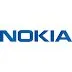 A Nokia smartphone sits on a desk next to market charts and brand logos.