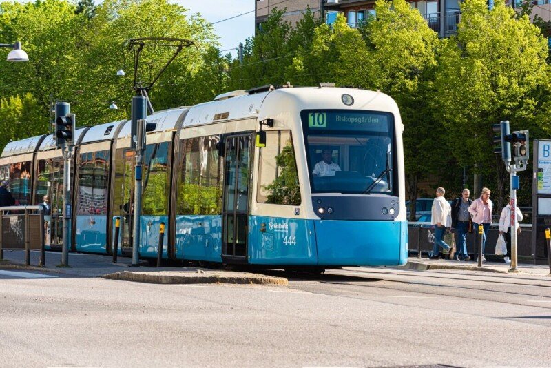 A damaged autonomous shuttle sits beside a tow truck after a rear-end collision in Gothenburg.