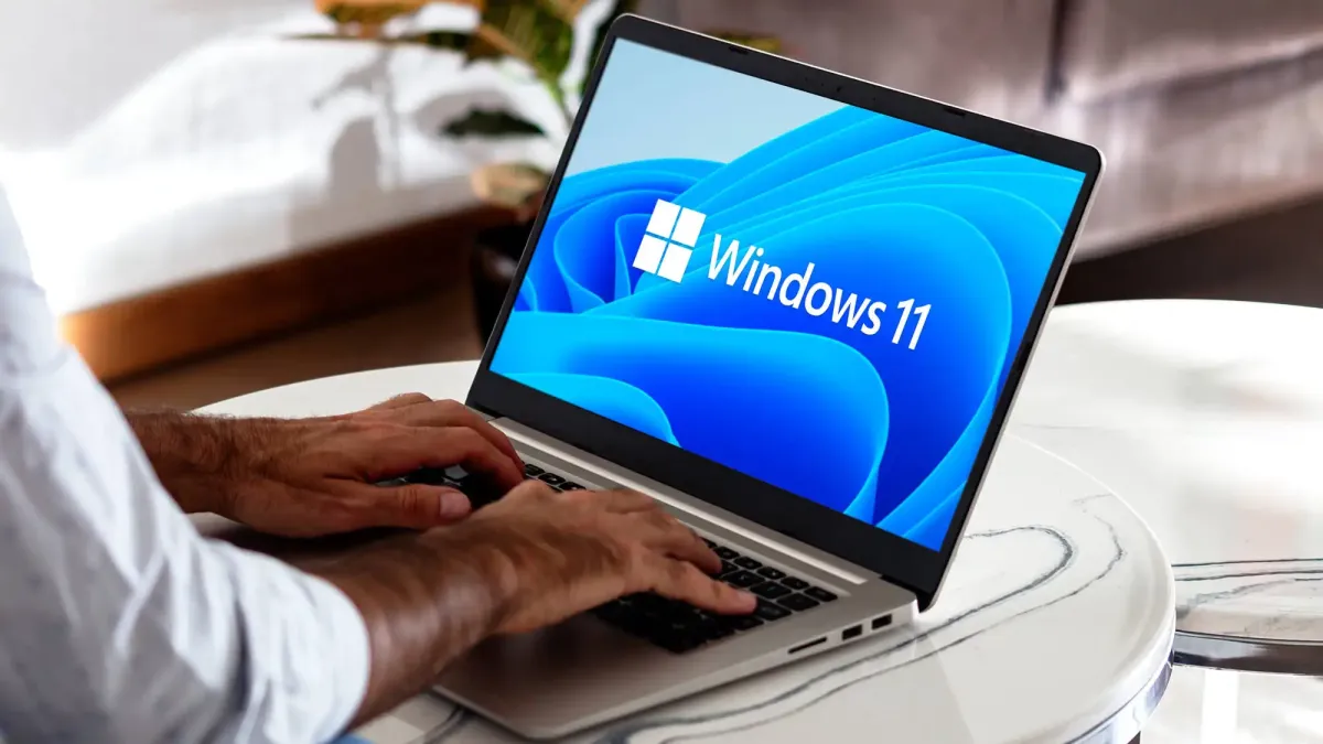 A computer monitor displays a Windows 11 Secure Boot certificate expiration warning for June 2026.