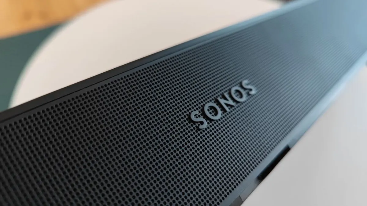 The Sonos Beam Gen 2 soundbar rests on a media console.
