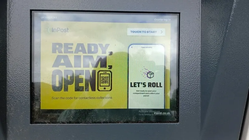 An InPost locker displays a Microsoft Windows activation warning on its screen.
