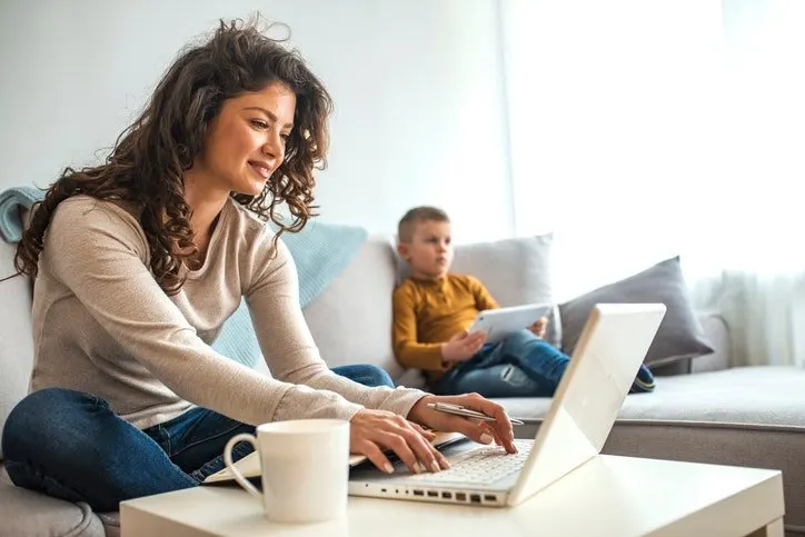 A wireless router sits on a central shelf to illustrate optimal placement for consistent home network coverage.