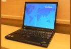 An IBM ThinkPad T43 laptop displays a Windows installation screen during a bare-metal setup process.