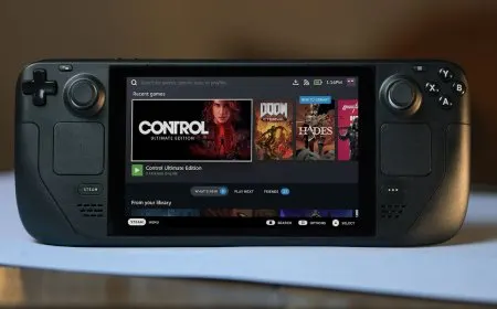A handheld gaming PC rests on a surface with its screen and controls clearly visible.