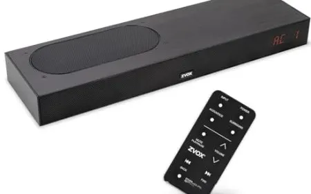 A modern soundbar rests on a media console to deliver clear dialogue playback.