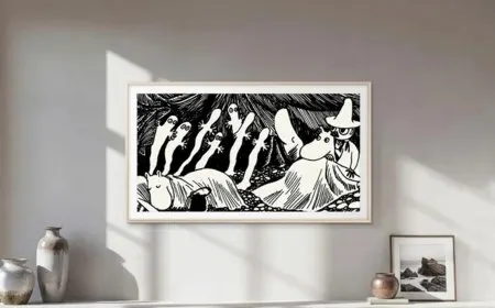 A Samsung smart television displays curated Moomin artwork illustrations.