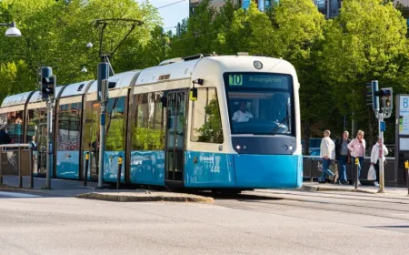 A damaged autonomous shuttle sits beside a tow truck after a rear-end collision in Gothenburg.