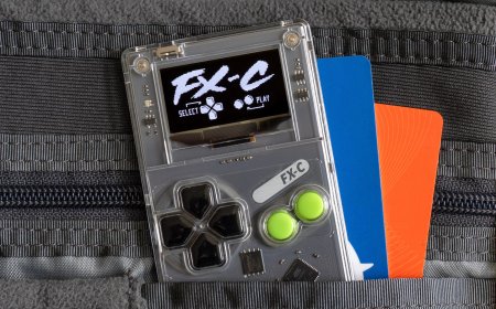The Arduboy FX-C handheld console is shown from the front, highlighting its credit card size and monochromatic screen.