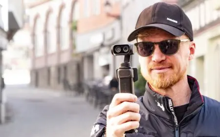 Insta360 Luna vlogging camera featuring a detachable screen, integrated microphone, and tracking controls.