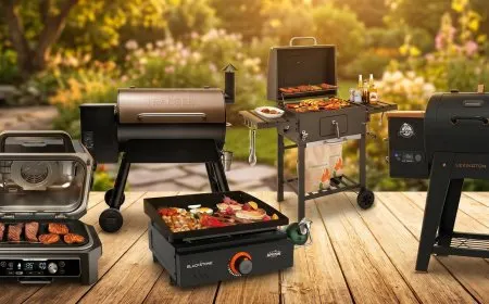 Various charcoal and gas grills are displayed for Memorial Day sales.