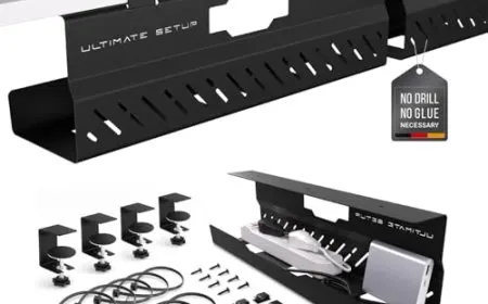 A metal cable tray mounts under a desk to organize power and data cables within a concealed channel.