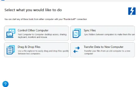 Two Windows 11 computers connect directly via a Thunderbolt cable to share files and peripherals.