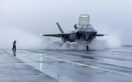 An F-35 fighter jet carries a US StormBreaker glide bomb during flight.