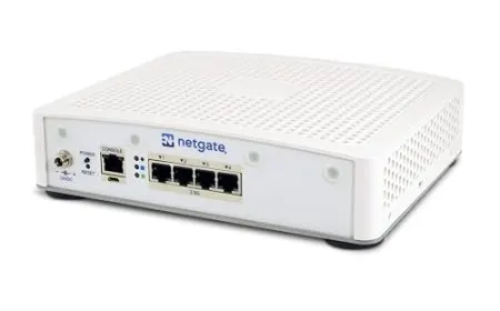 A dedicated firewall appliance manages network traffic for a residential setup.