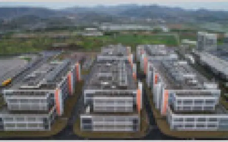 Server racks are arranged in rows inside a modern data center facility.