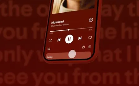 The Spotify mobile interface displays the new playlist folder feature for organizing music collections.