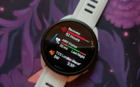 Garmin Forerunner 165 smartwatch displaying running metrics and pricing information