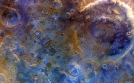 Mars surface showing Huygens crater and southern polar ice fields captured by the Psyche spacecraft during its gravity ass...