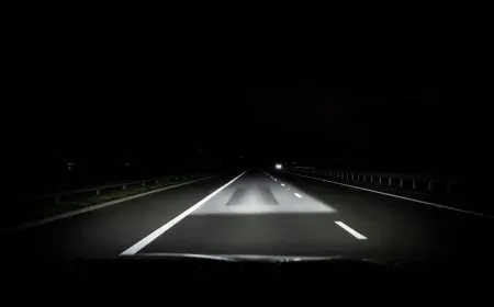 The adaptive driving beam headlight masks light around other vehicles while maintaining forward illumination.