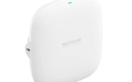 Multiple enterprise wireless access points are mounted on a residential ceiling.