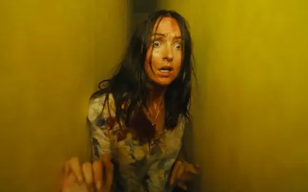 The film features a dimly lit hallway with yellow wallpaper and fluorescent lighting.
