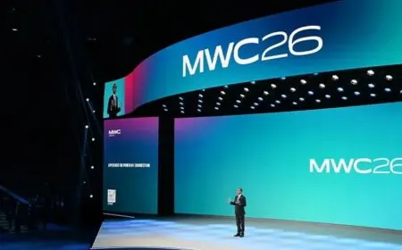 Booth displays showcase ultra-thin smartphones and modular networking hardware at the MWC 2026 exhibition.