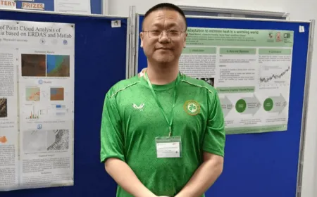 Maynooth PhD researcher Chao Gong working with geospatial analysis software and GIS mapping tools