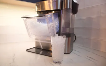 A white GE Profile Opal 2.0 Ultra Nugget Ice Maker sits on a countertop.