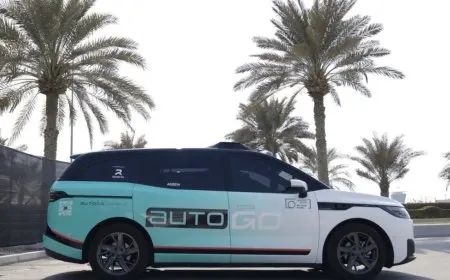 A Baidu Apollo Go autonomous taxi travels along a street in Abu Dhabi.