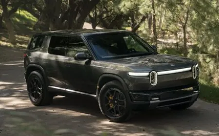 The Rivian R2 electric SUV is shown at a delivery center.
