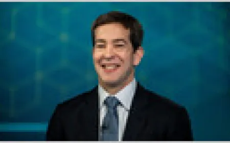 Okta stock chart and Q1 earnings data showing revenue beat and after-hours price jump