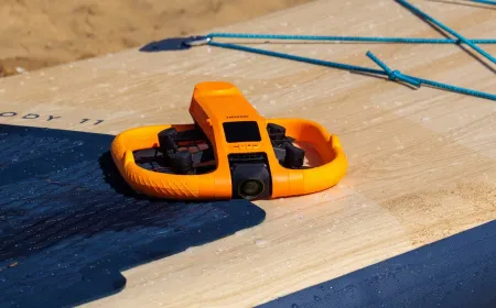 The HoverAir Aqua waterproof drone hovers above water.