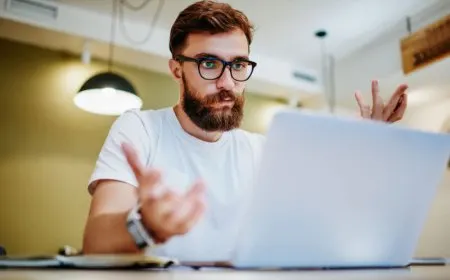 Web developers using artificial intelligence tools for code generation in a modern workspace.