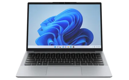 The Chuwi UniBook and MacBook Neo laptops are displayed side by side to compare their physical ports and screen quality.