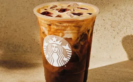 Starbucks syrup bottles arranged on a shelf.