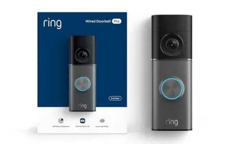 The Ring Wired Doorbell Pro sits on an exterior wall, clearly showing its wired power connection and compact design.