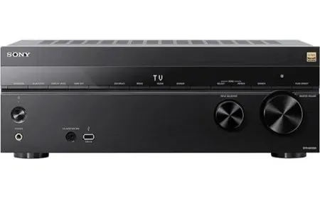 A modern home theater receiver displays its front control panel and input ports.