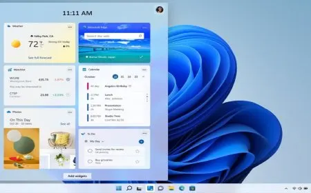 The Windows 11 desktop features a centered start menu and a refreshed translucent design language.