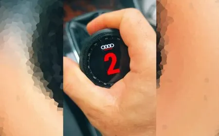 Custom 3D printed enclosure housing a repurposed WearOS smartwatch screen and motherboard mounted to a gear lever.