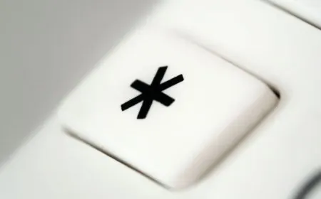 A vintage mainframe terminal displays an asterisk symbol representing a wildcard error.