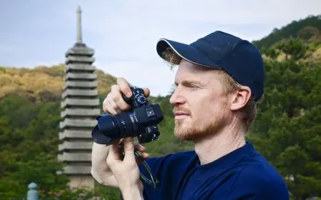 The Panasonic Lumix G1 mirrorless camera is shown with its lens attached.