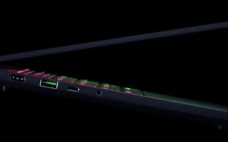 The Razer Blade 14 laptop is shown open with its slim chassis and OLED display visible.