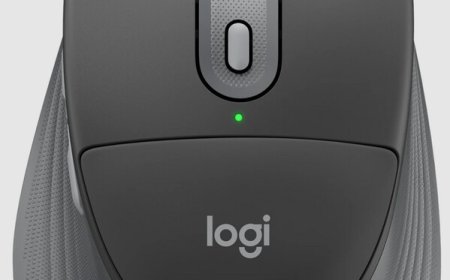 Logitech Signature Comfort Plus ergonomic peripherals are arranged on a clean desk surface.