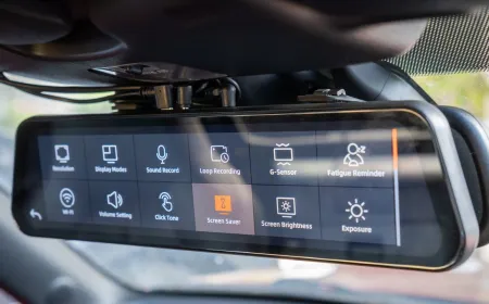 Enterprise smart dash cam mounted on a vehicle windshield with visible sensor array and wiring