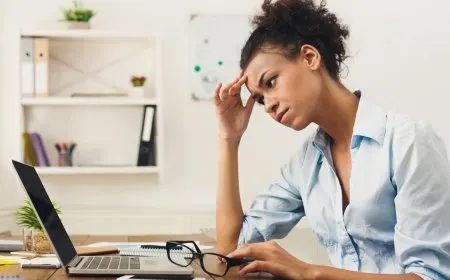 A professional reviews a digital dashboard displaying artificial intelligence adoption and hiring trends.