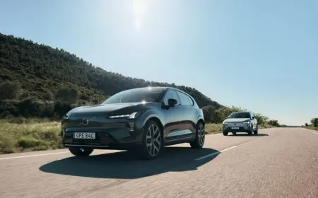 The Volvo EX60 electric crossover is shown from the front, displaying its exterior design and SPA3 platform features.