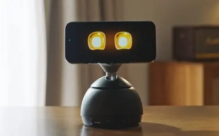 Smartphone mounted on a motorized base that physically tracks user movement across a workspace while charging.
