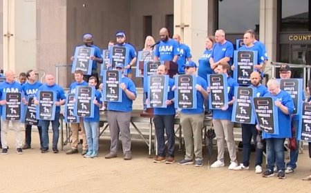 Union workers rally outside Apple Towson store to protest closure and alleged discriminatory practices.