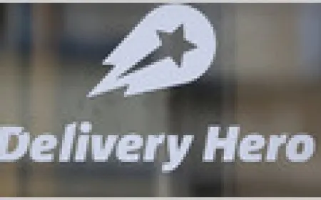 Uber and Delivery Hero logos represent the takeover offer.